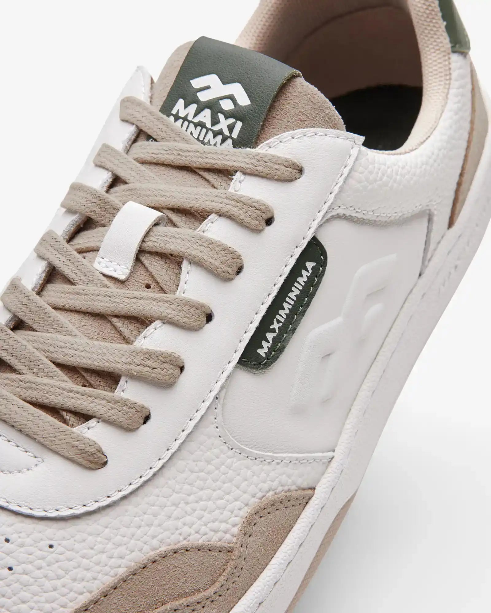 Maximinima Axis off-white and green barefoot sneaker close-up showing upper material, laces and branding detail