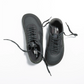 Top view of black barefoot sneakers with wide toe box and minimalist design