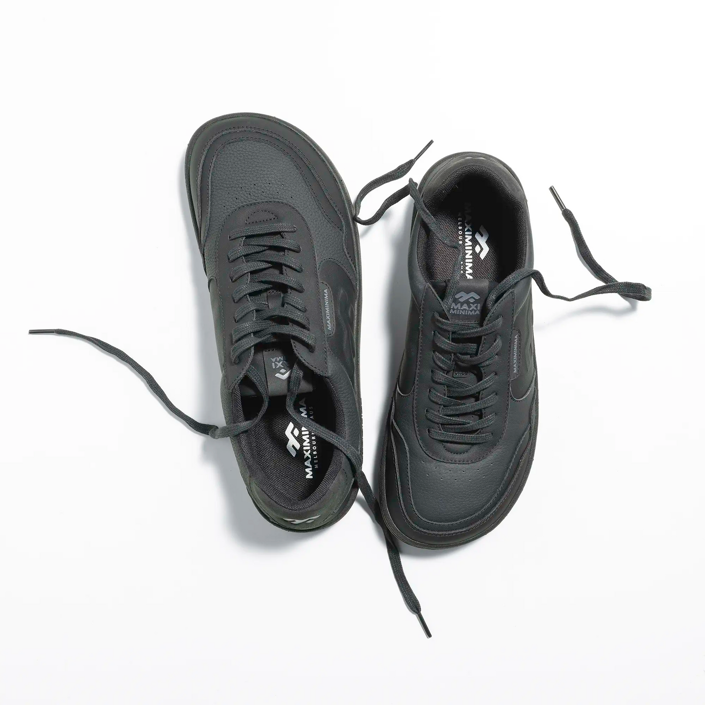 Top view of black barefoot sneakers with wide toe box and minimalist design