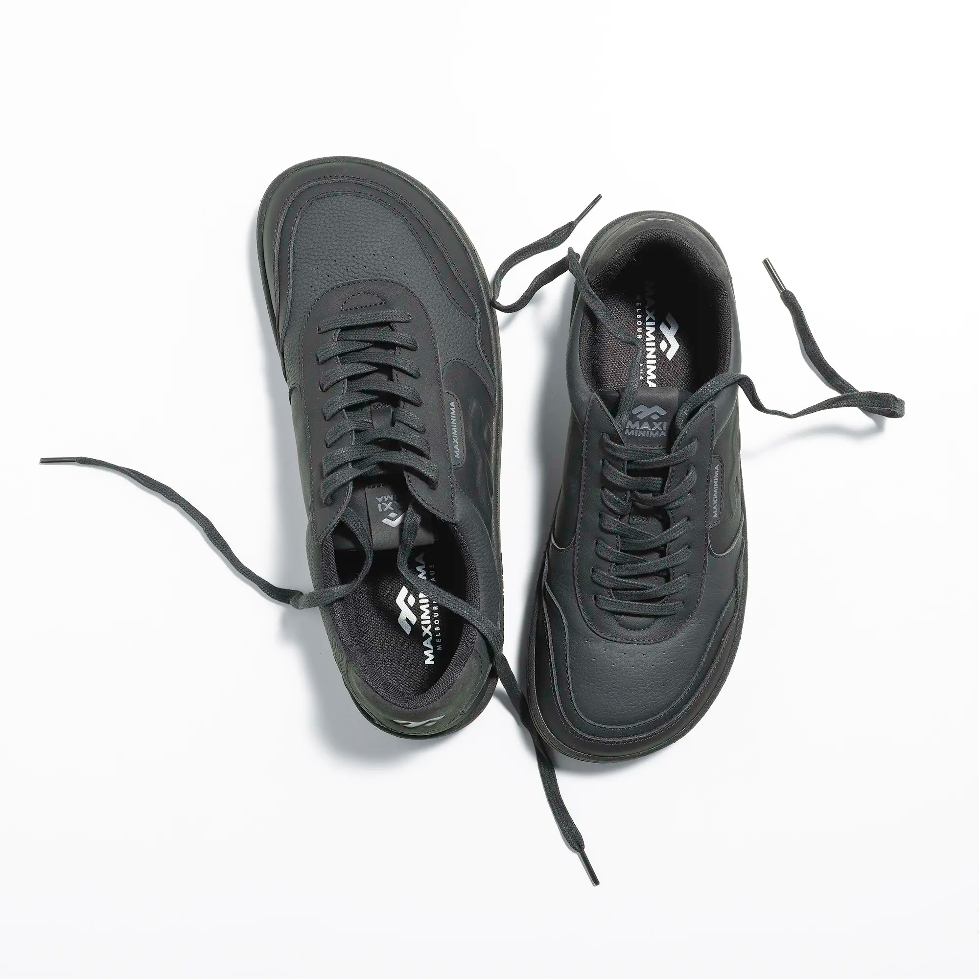 Top view of black barefoot sneakers with wide toe box and minimalist design